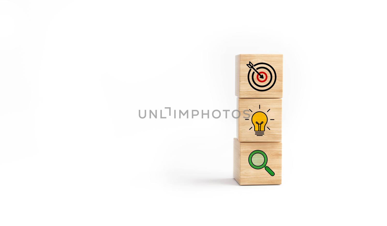 Concept of business strategy and action plan. Wooden cube block with icon target, light bulb and search on white background. by ImagesRouges