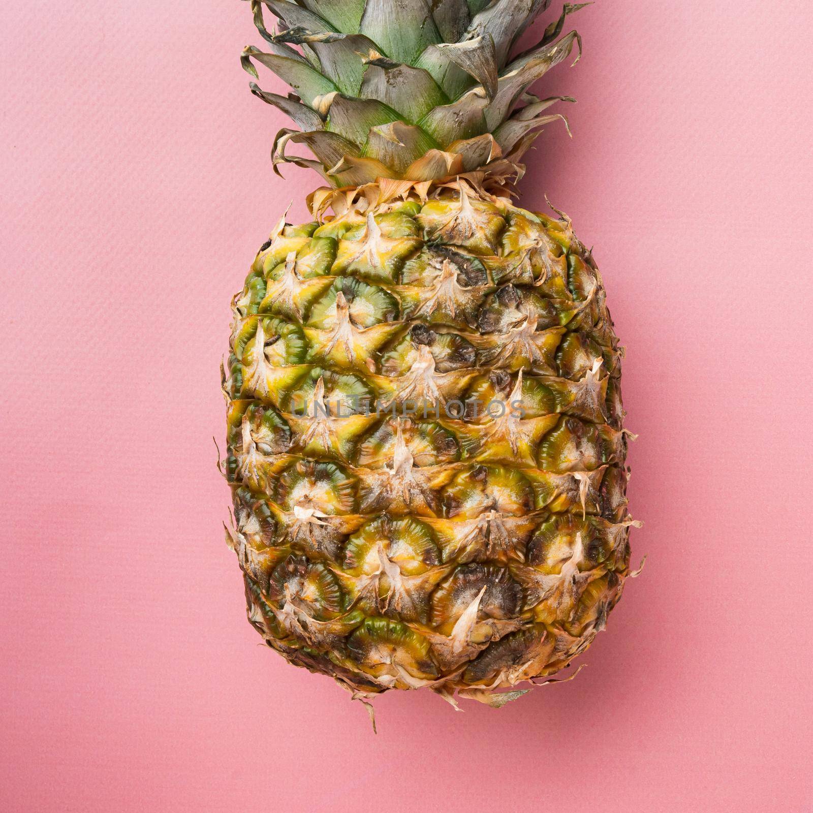 Hawaiian pineapple set, on pink textured summer background, top view flat lay