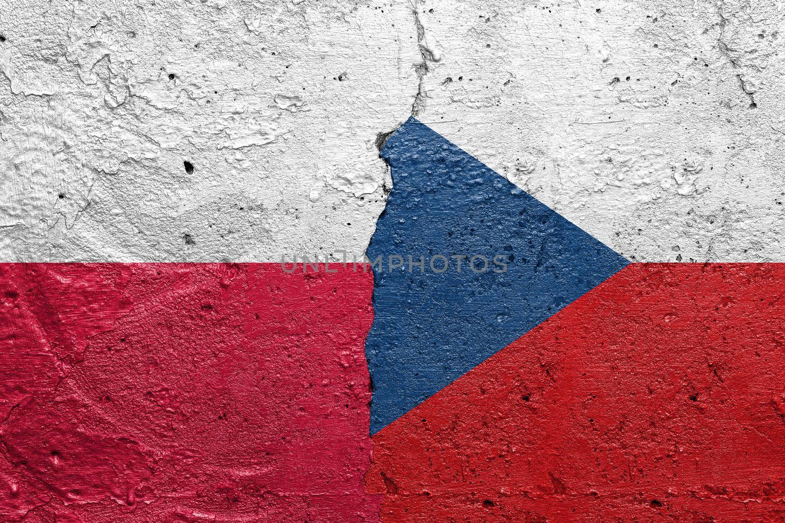 Poland and Hungary - Cracked concrete wall painted with a Polish flag on the left and a Hungary flag on the right