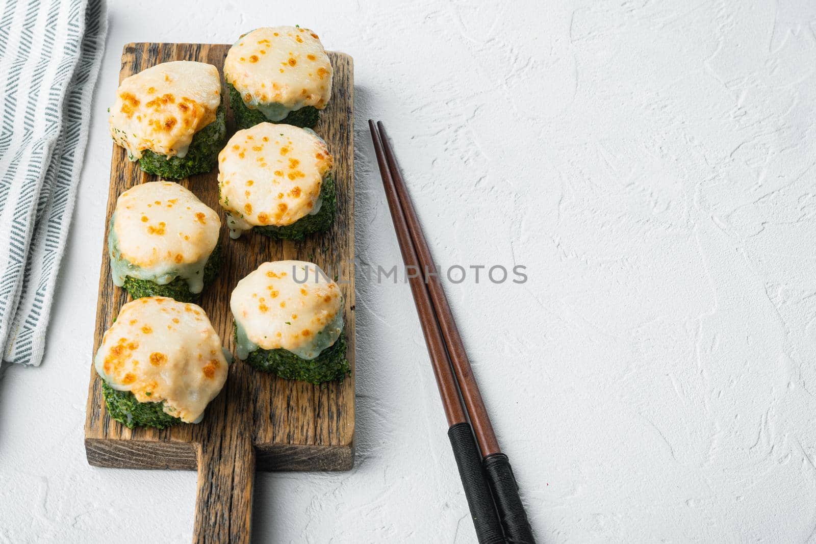 Japanese sushi rolls named Baked Ebi with wasabi and salmon fish set, on white stone background , with copyspace and space for text