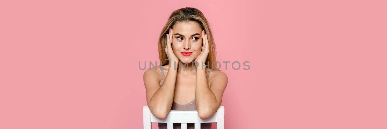 Casual beauty concept of pretty young woman on pink background. Web banner.