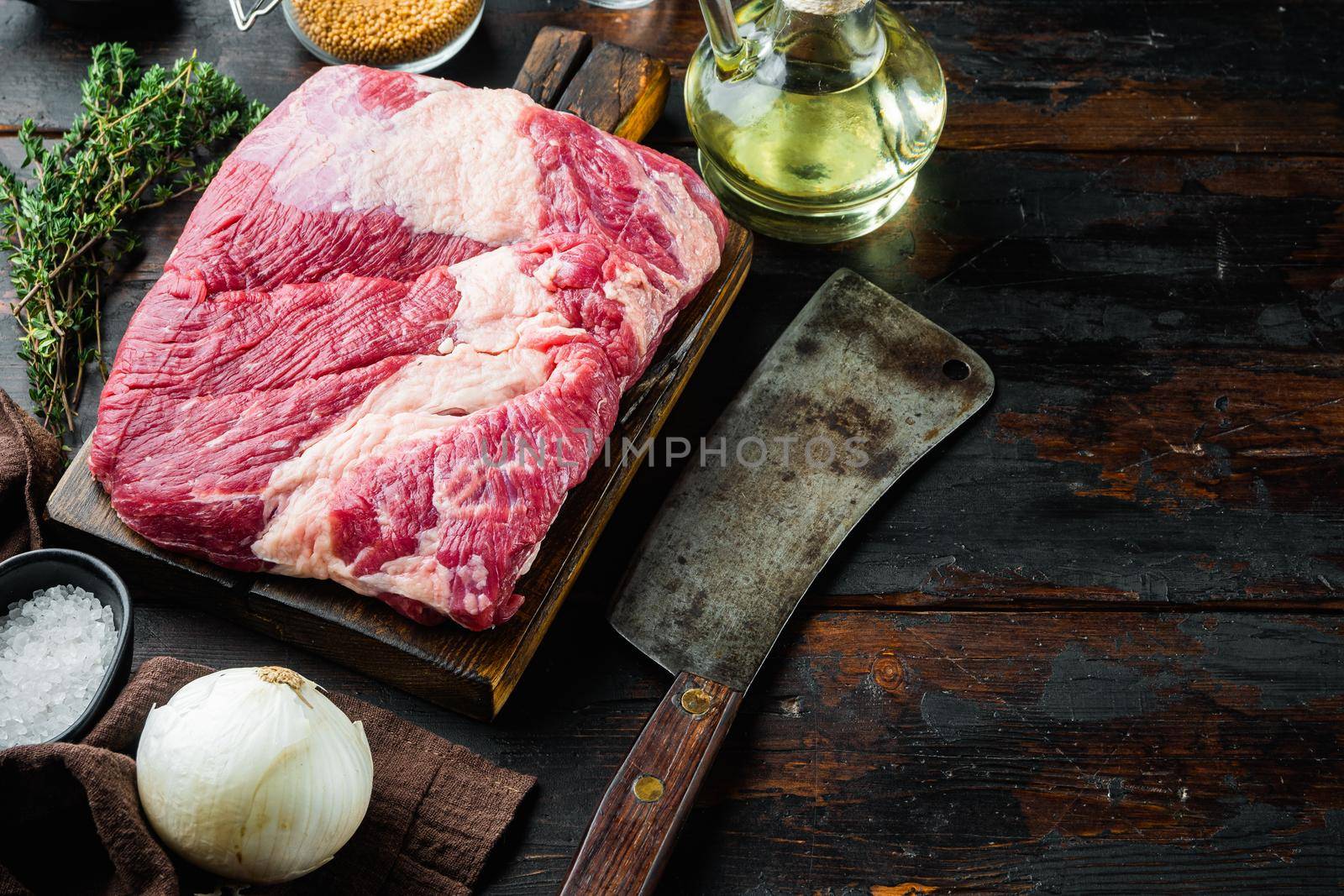 Point brisket, raw beef brisket meat,with ingredients for smoking making barbecue, pastrami, cure, on old dark wooden table background, with copy space for text by Ilianesolenyi