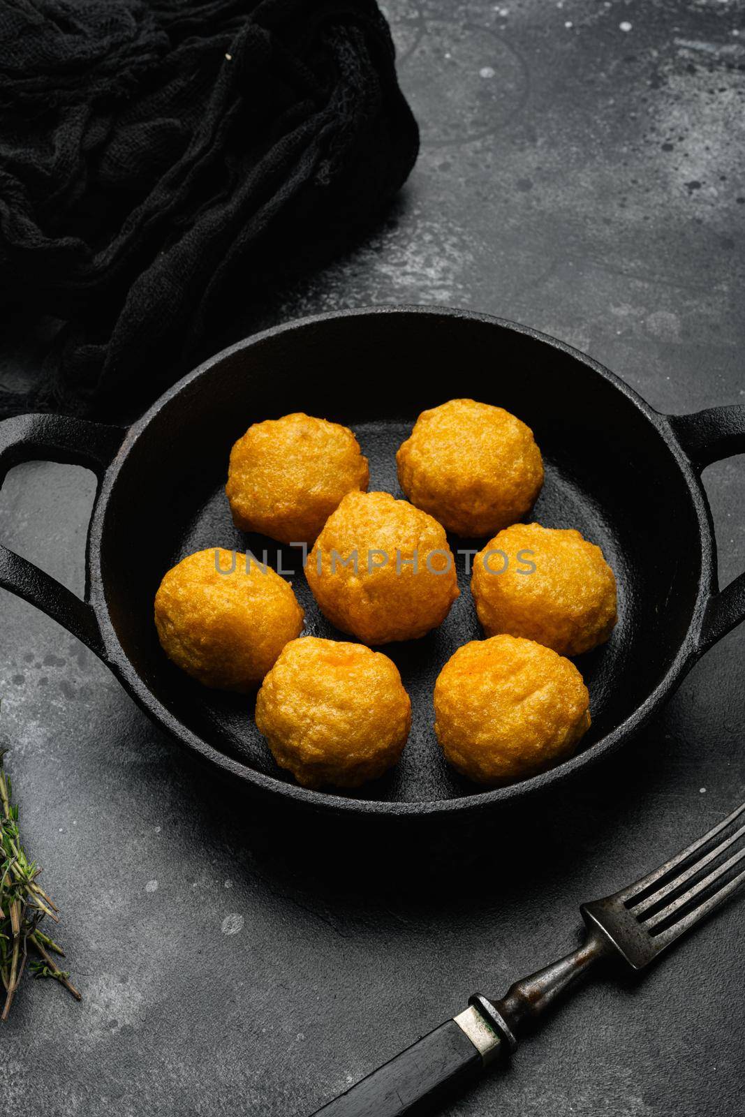 Battered meat on black dark stone table background by Ilianesolenyi