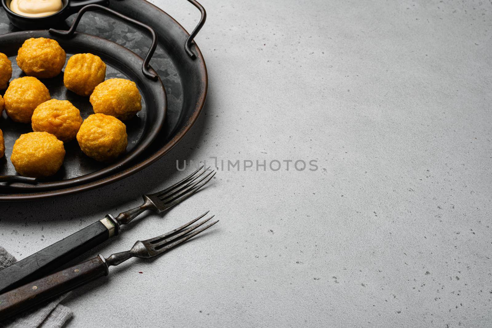 Battered meat on gray stone table background, with copy space for text by Ilianesolenyi