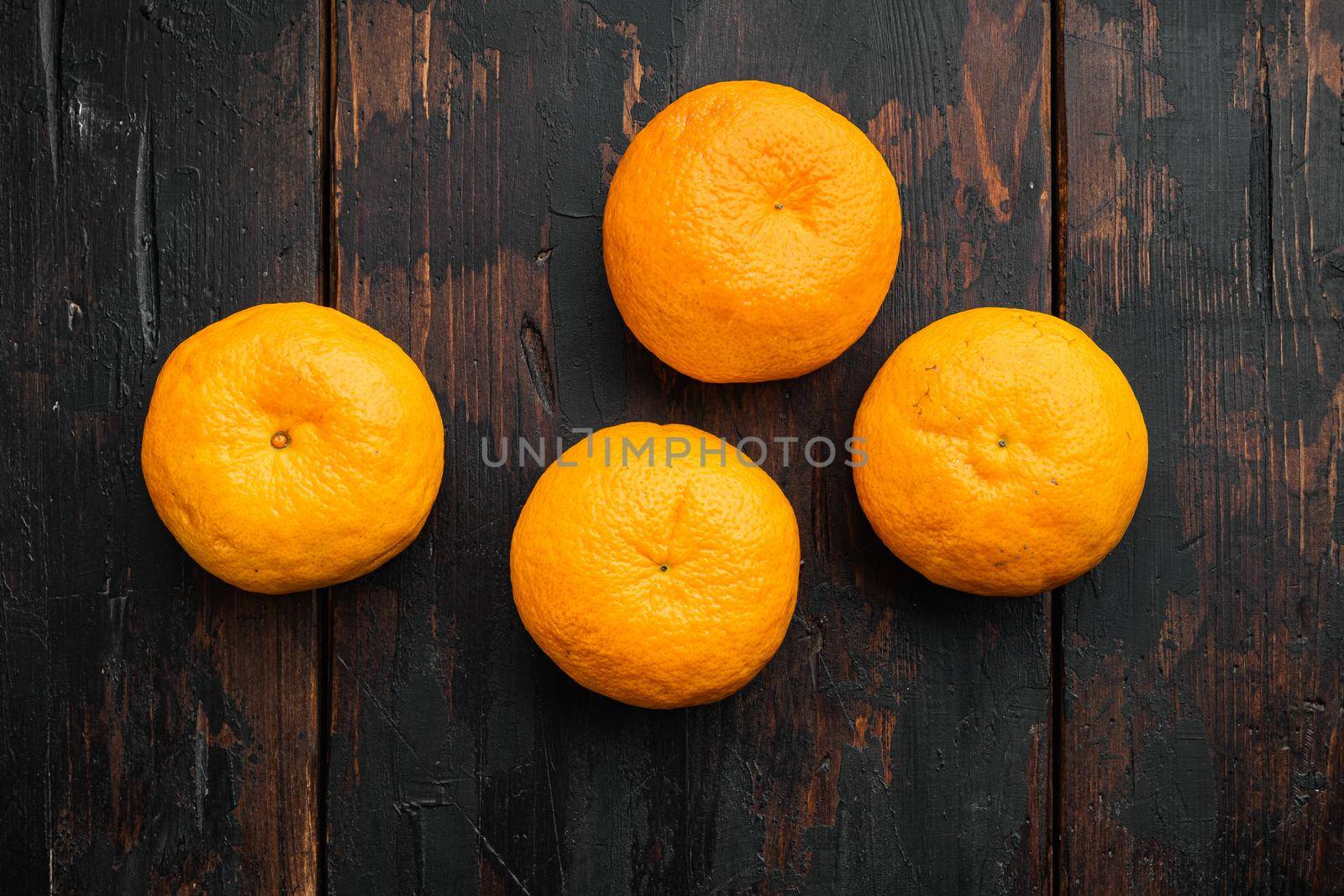 Tangerine whole set, on old dark wooden table background, top view flat lay