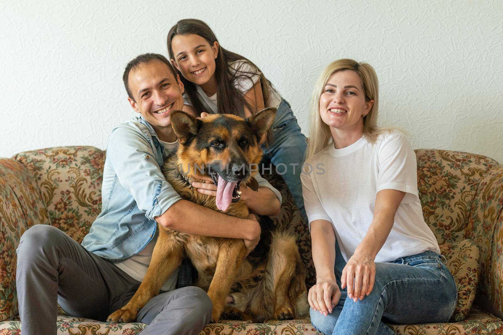 german shepherd and family. German shepherd is the best friend of the child