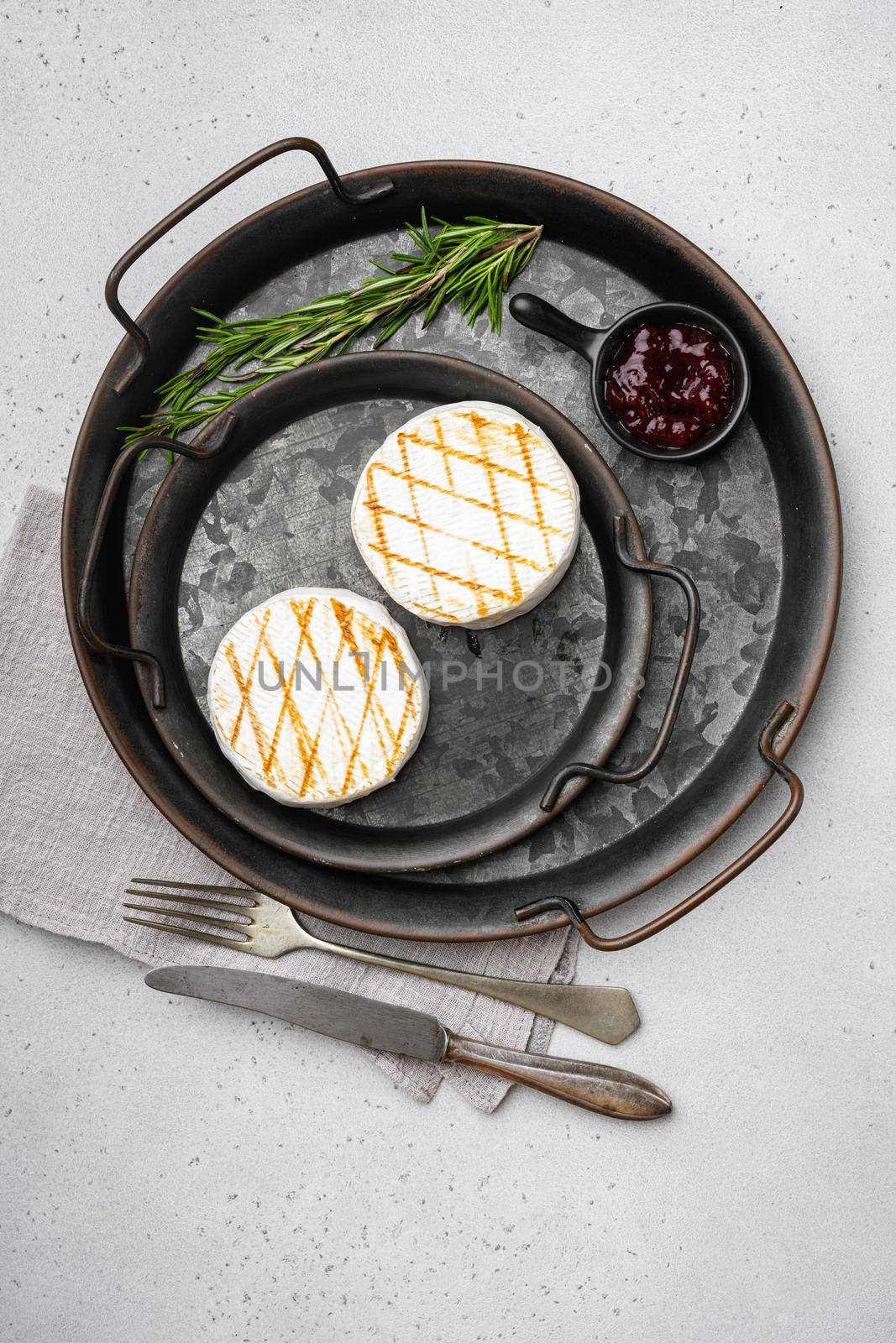Homemade Baked Camembert cheese on gray stone table background, top view flat lay by Ilianesolenyi
