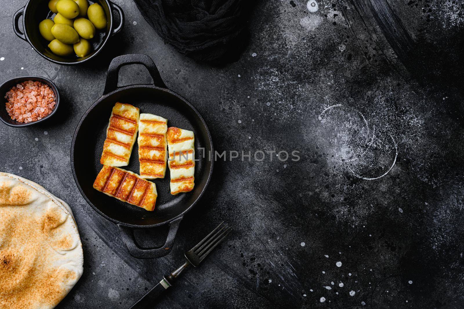Grilling Halloumi Cheese set, on black dark stone table background, top view flat lay, with copy space for text