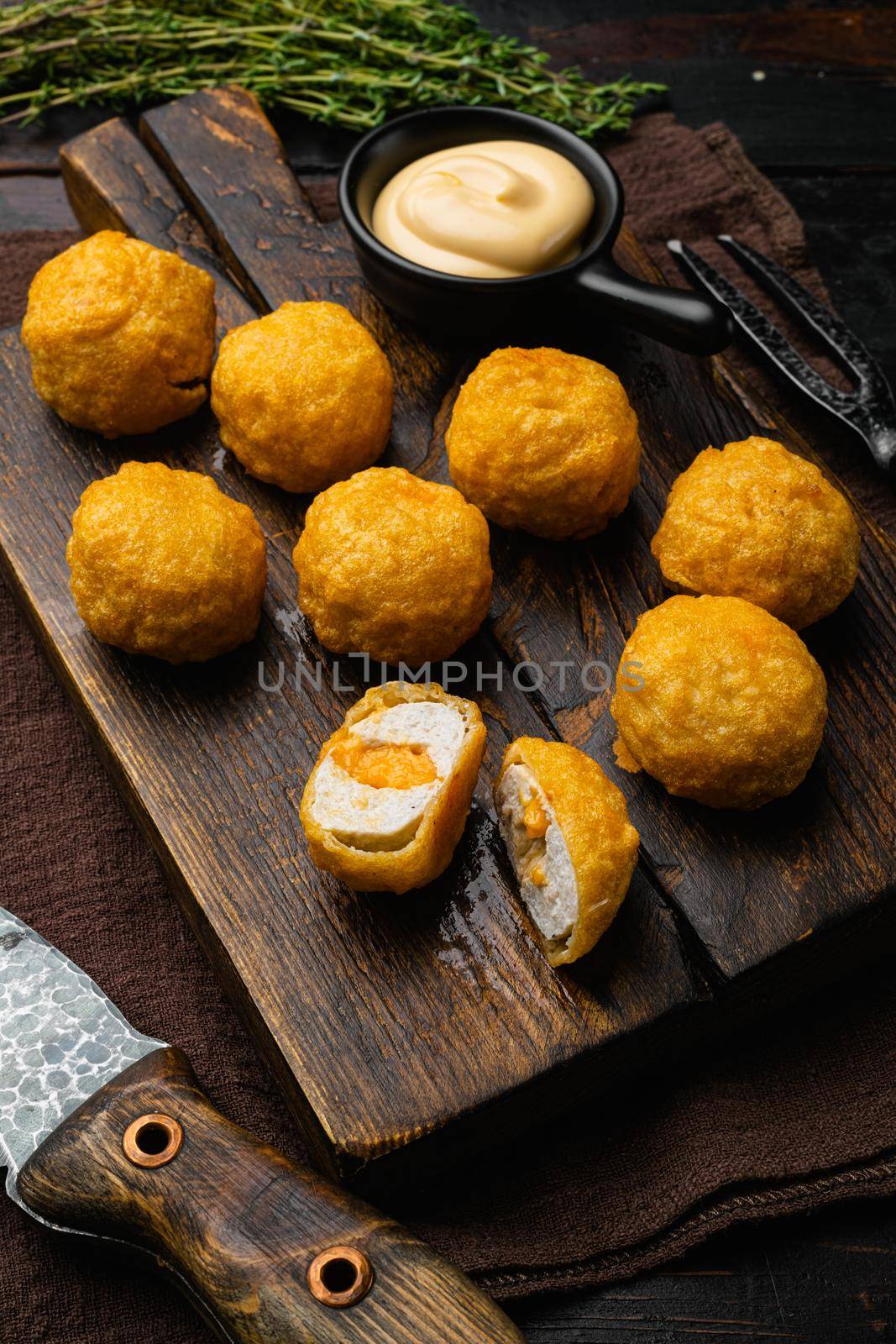 Battered sausage meat ball on old dark wooden table background by Ilianesolenyi