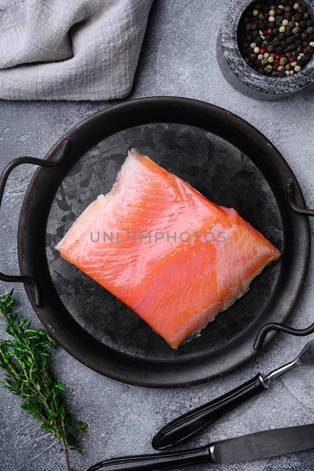 Fresh fish. Salmon fillet set, on gray stone table background, top view flat lay by Ilianesolenyi