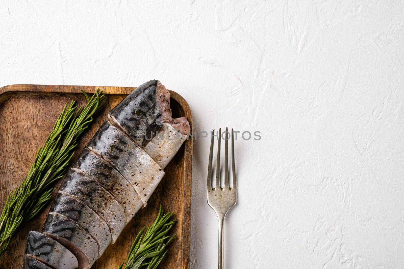 Fresh fish mackerel, on white stone table background, top view flat lay, with copy space for text by Ilianesolenyi