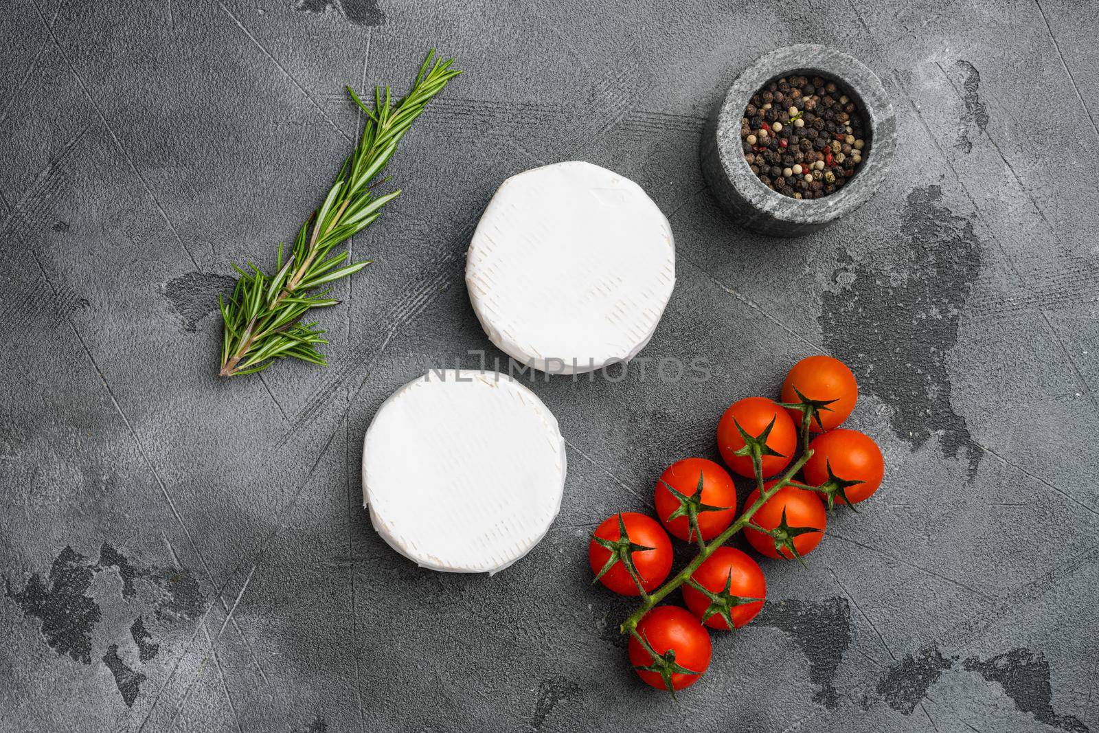 Brie cheese on gray stone table background, top view flat lay, with copy space for text by Ilianesolenyi