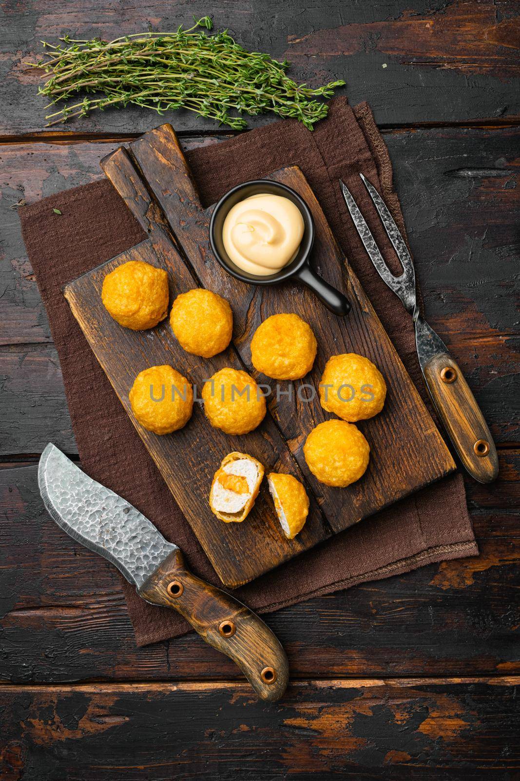 Battered meatballs, on old dark wooden table background, top view flat lay
