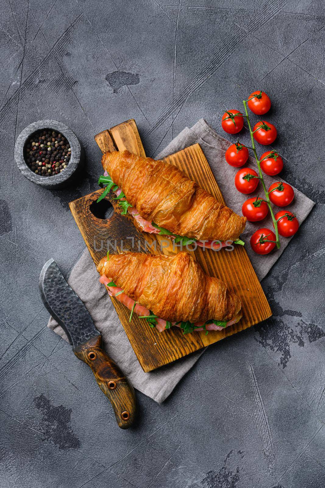 Sandwich with salted salmon, on gray stone table background, top view flat lay by Ilianesolenyi