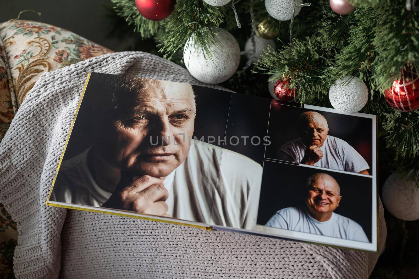 family photo book near the Christmas tree.