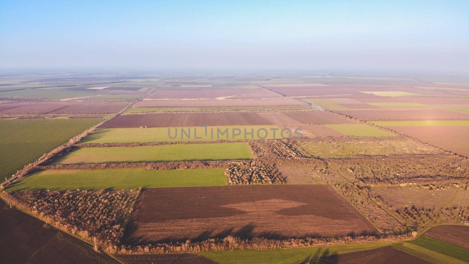 Countryside farm green and brown agriculture fields. Aerial photo by igor010