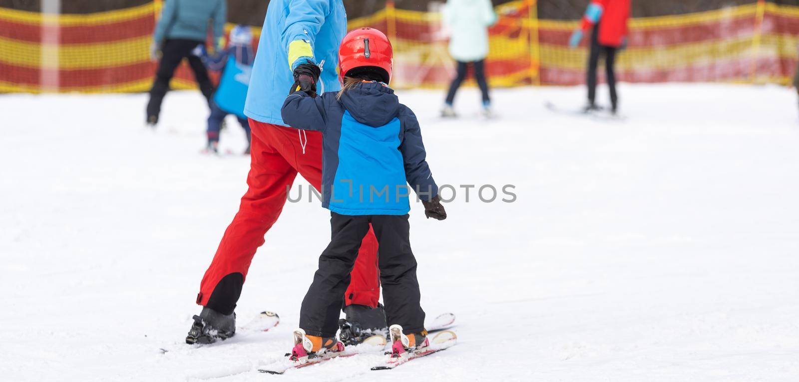 skiing master class for kids with instructor in winter sports school for children