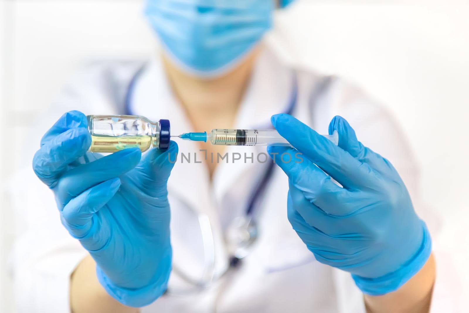 Doctor filling syringe with medication, closeup. Vaccination and immunization. Selective focus. Vaccine.