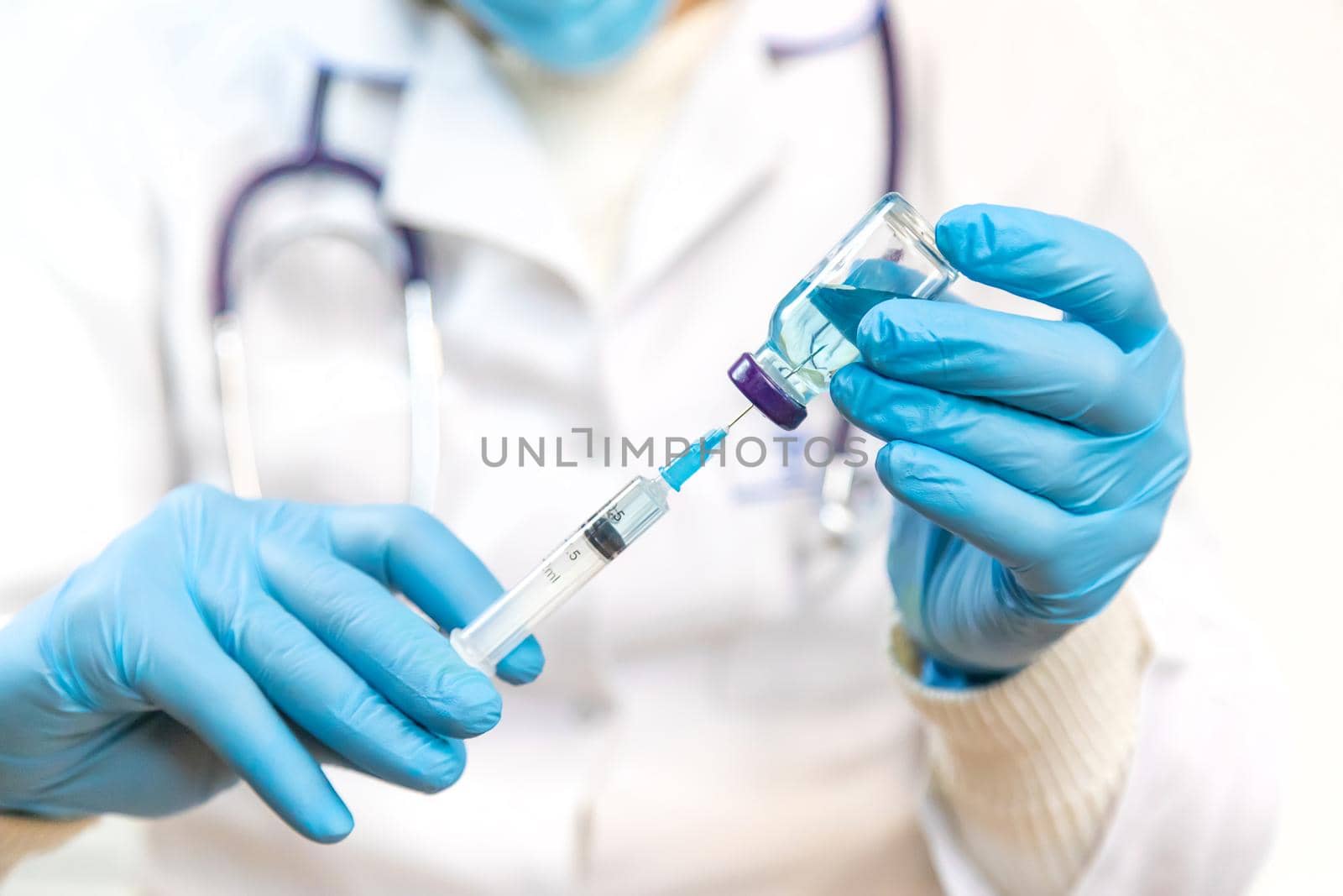 Doctor filling syringe with medication, closeup. Vaccination and immunization. Selective focus. Vaccine.