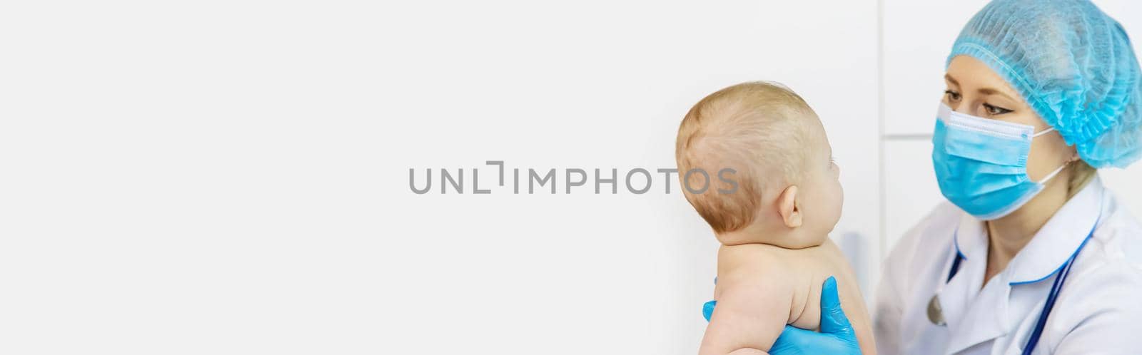 The baby is examined by a pediatrician at the hospital. Selective focus. by yanadjana