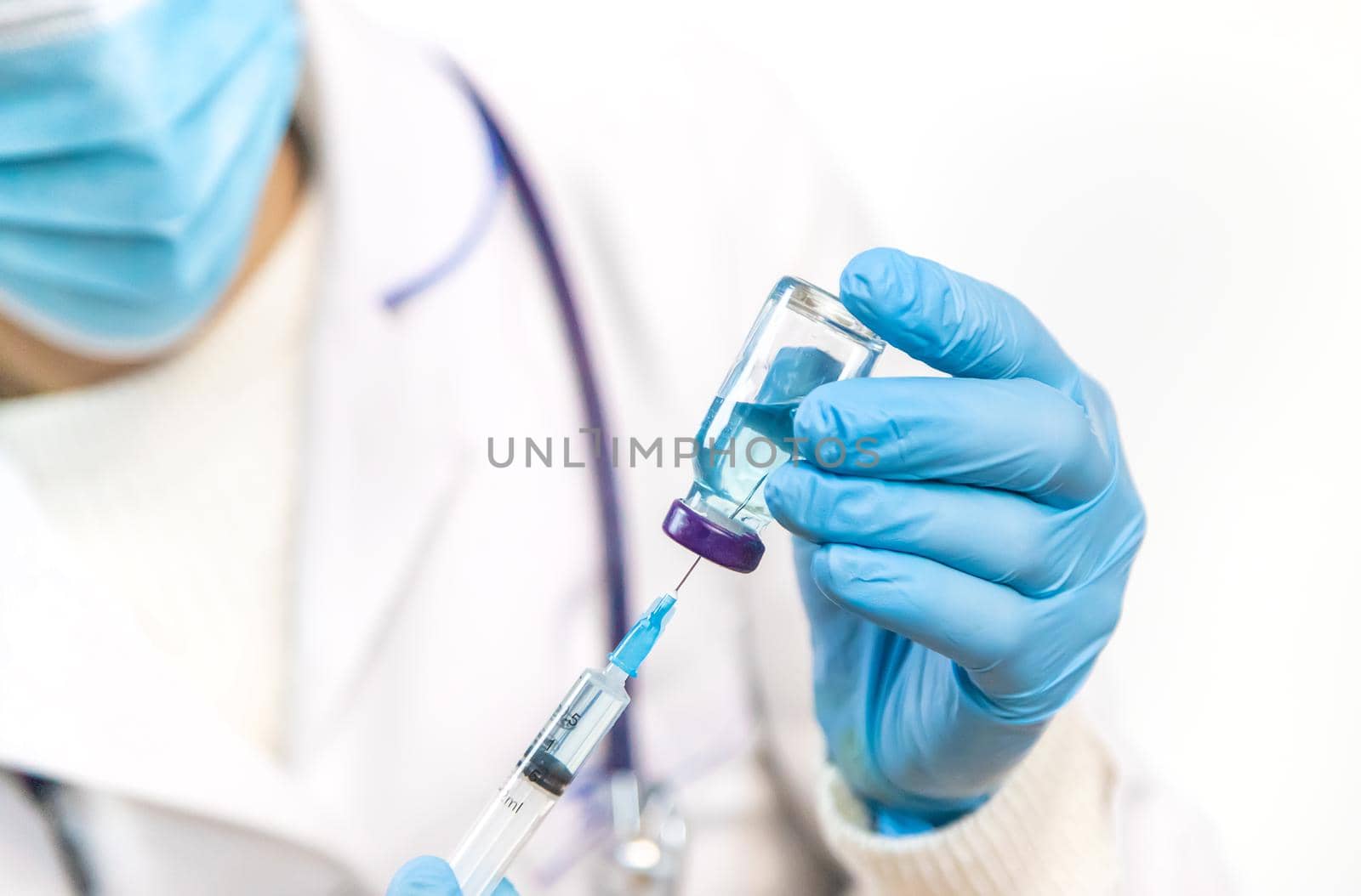 Doctor filling syringe with medication, closeup. Vaccination and immunization. Selective focus. Vaccine.