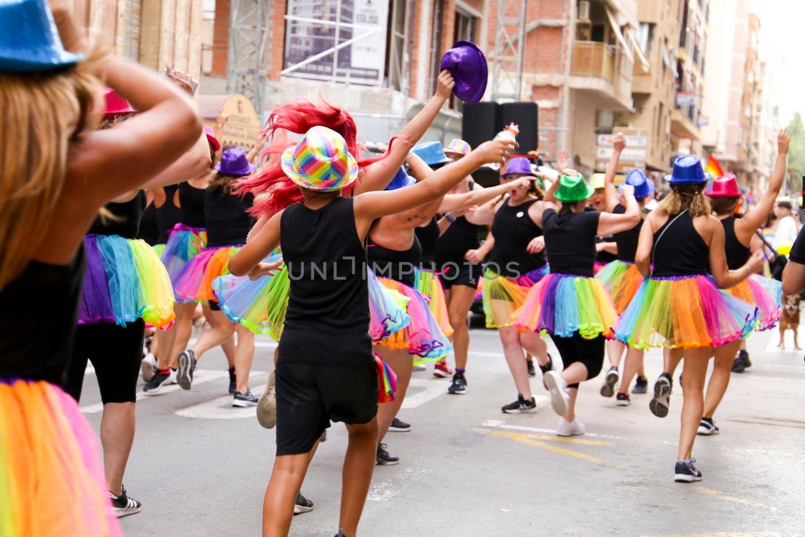 Santa Pola, Alicante, Spain- July 2, 2022: Group of dancers performing at the Gay Pride Parade in Santa Pola town, Alicante, Spain