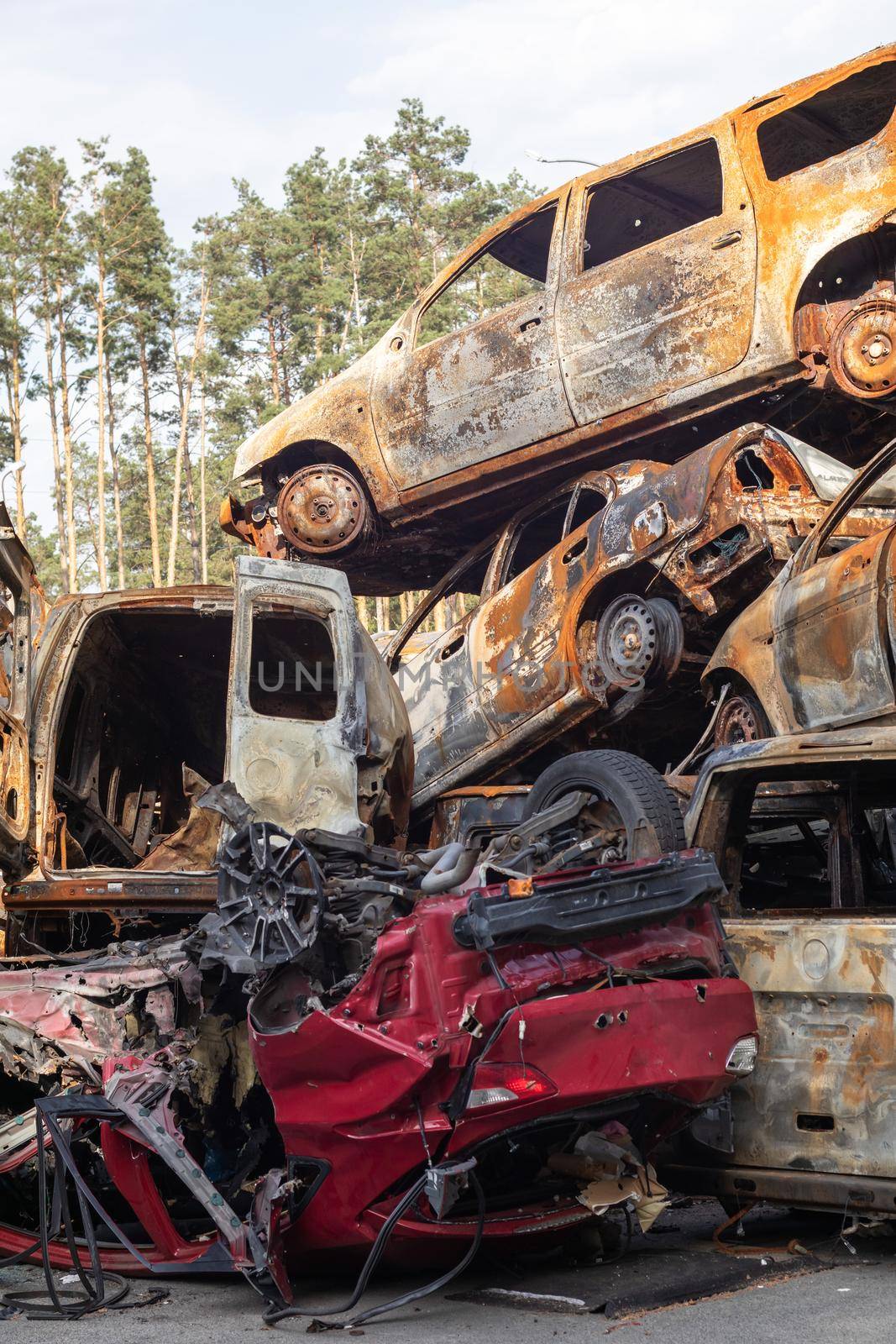 Auto in Irpen. Kyiv region, Ukraine. Russia Ukraine war. Cemetery of cars in Irpin, the consequences of the invasion of the Russian army in Ukraine. Destroyed cars of the civilian population