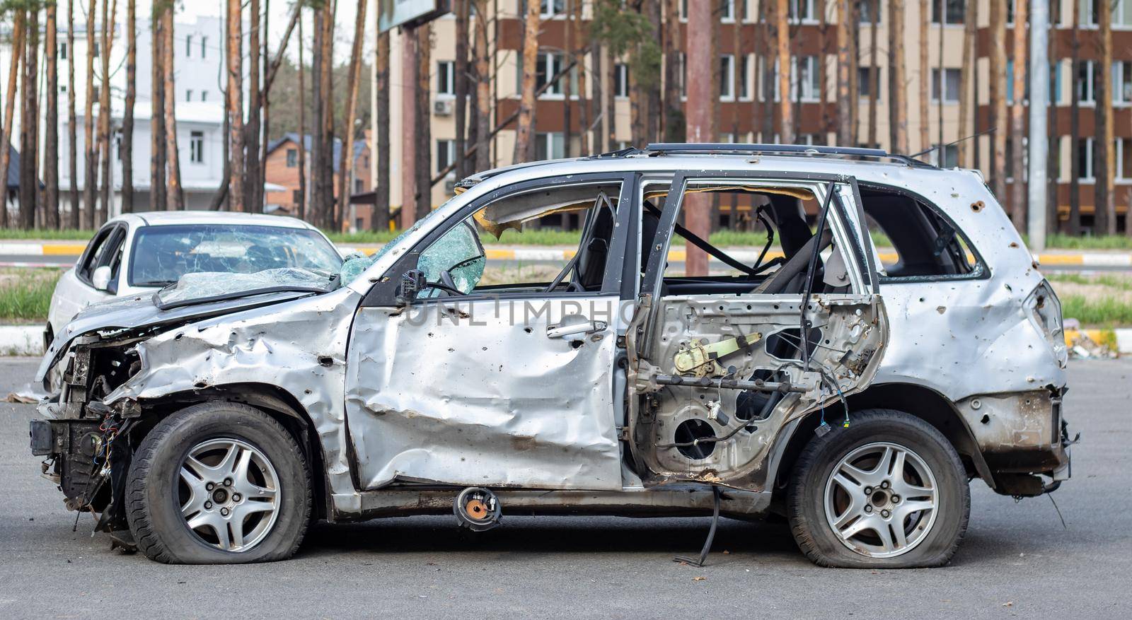 Car riddled with bullets. War of Russia against Ukraine. A car of civilians shot by the Russian military during the evacuation of women and children. Traces of bullets and fragments of shells