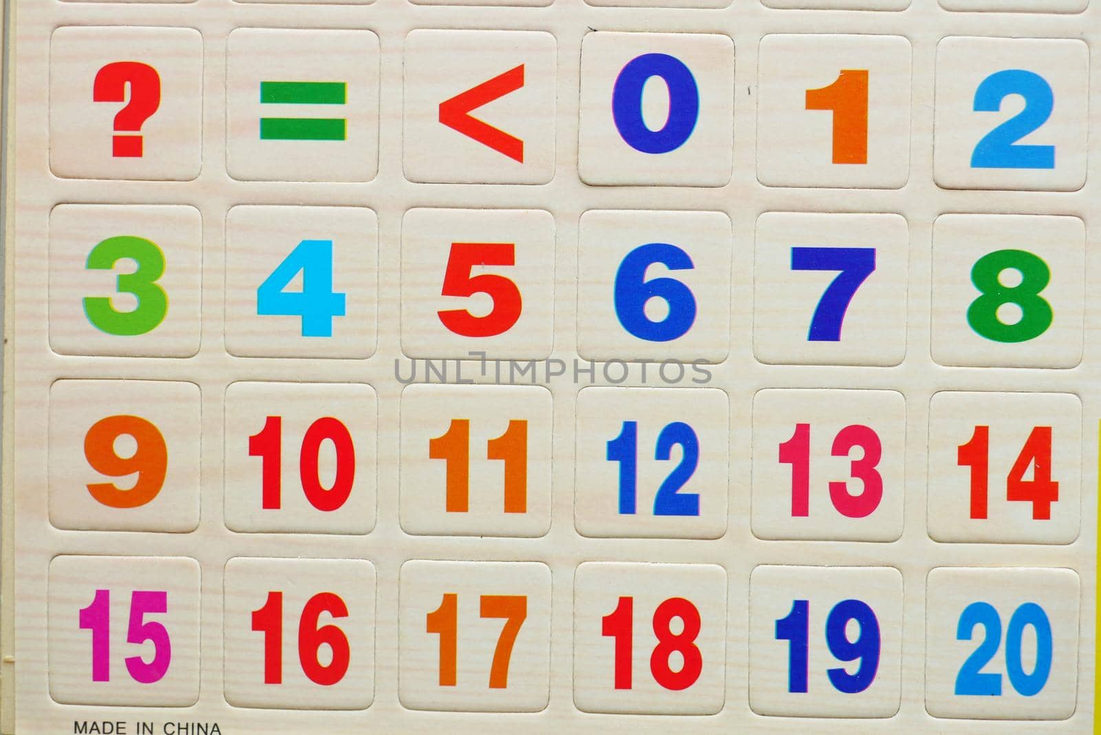 colorful plastic letters on white background, close up .