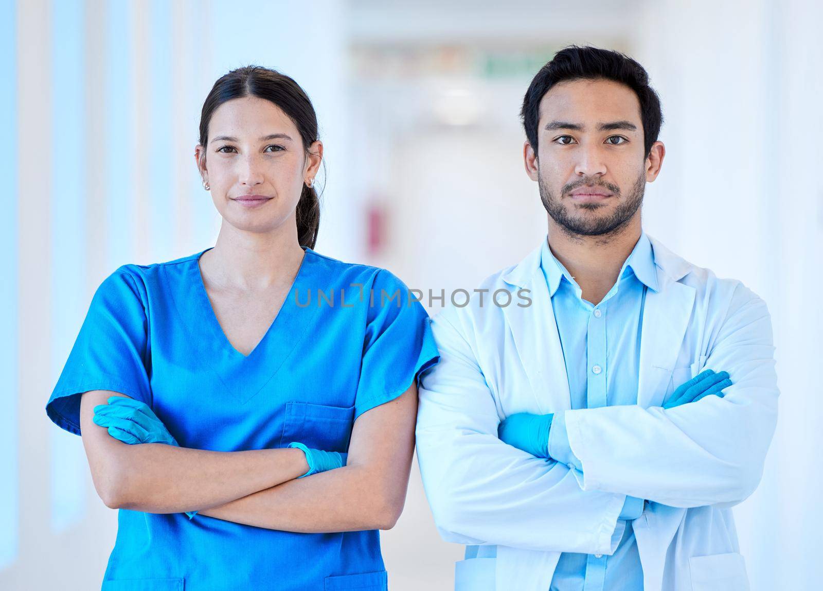 Shot of a young dentist with his assistant.