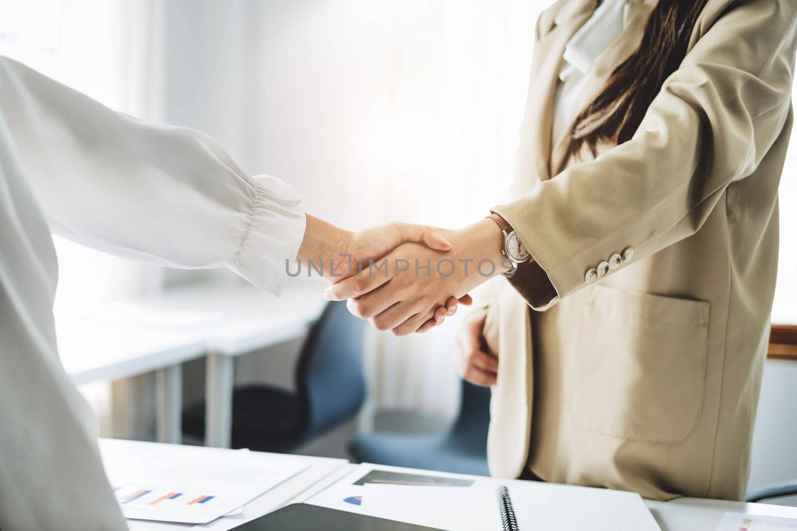 Young businesswoman collaborate with partners to increase their business investment network for Plans to improve quality next month in their office. agreement concept. by Manastrong