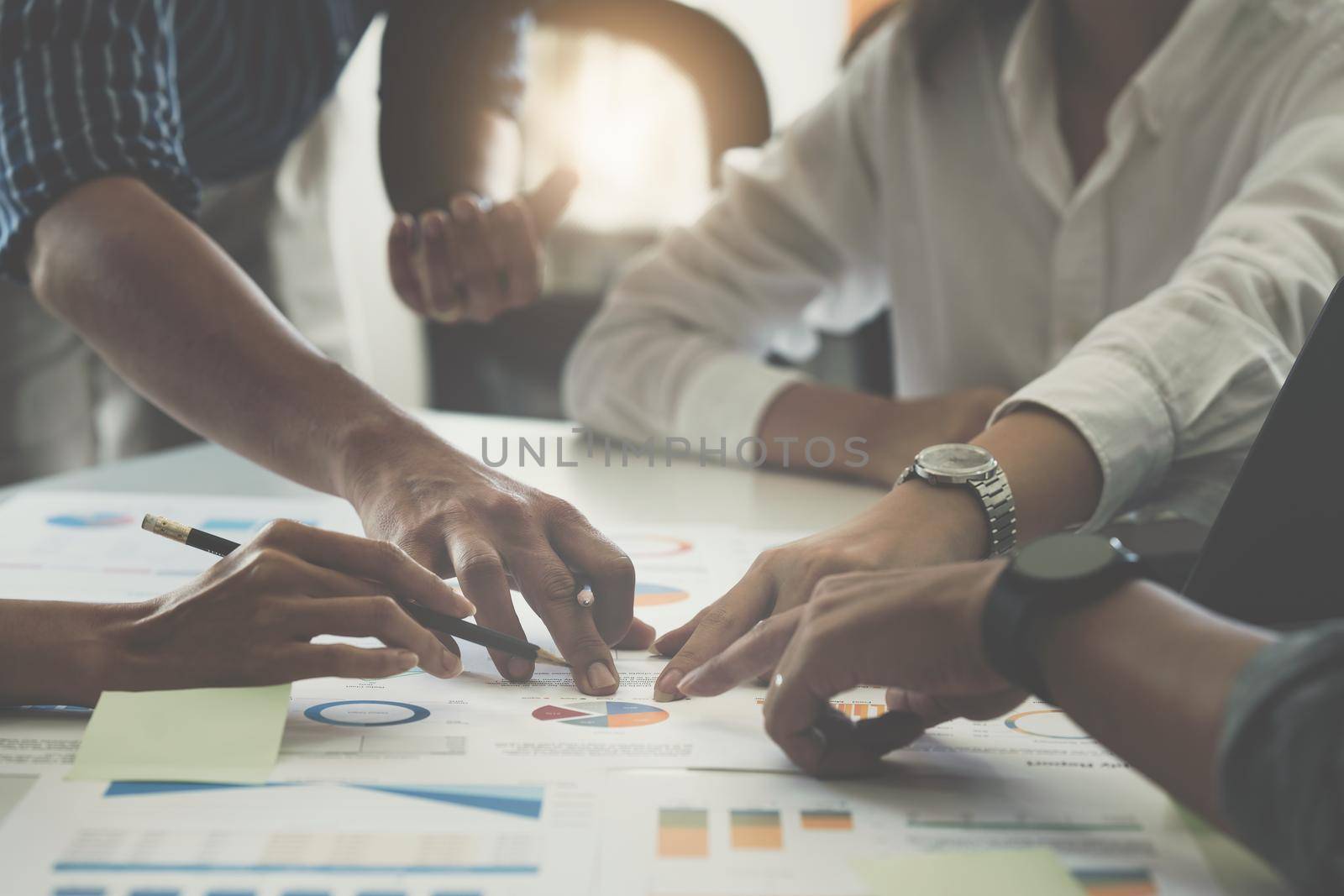 Group of business people working at workplace. Business team hands at working with financial plan, meeting, discussion, brainstorm with tablet on office desk