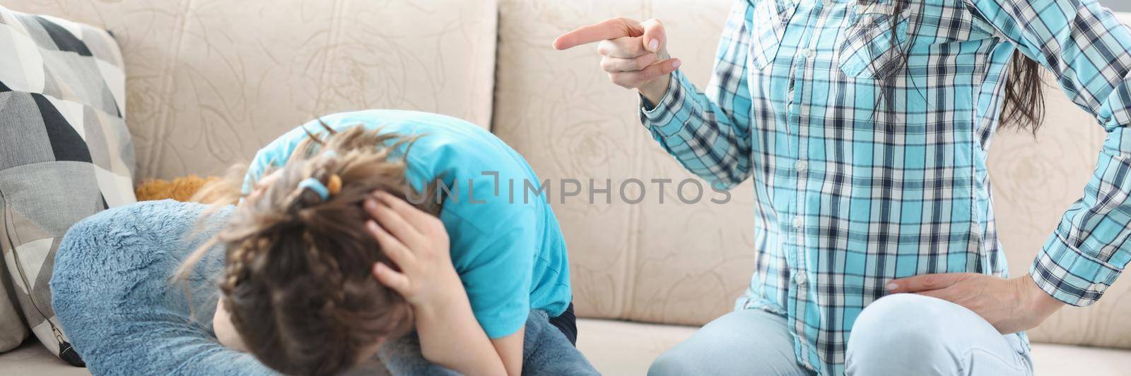 Millennial mother screaming shouting on little girl daughter by kuprevich