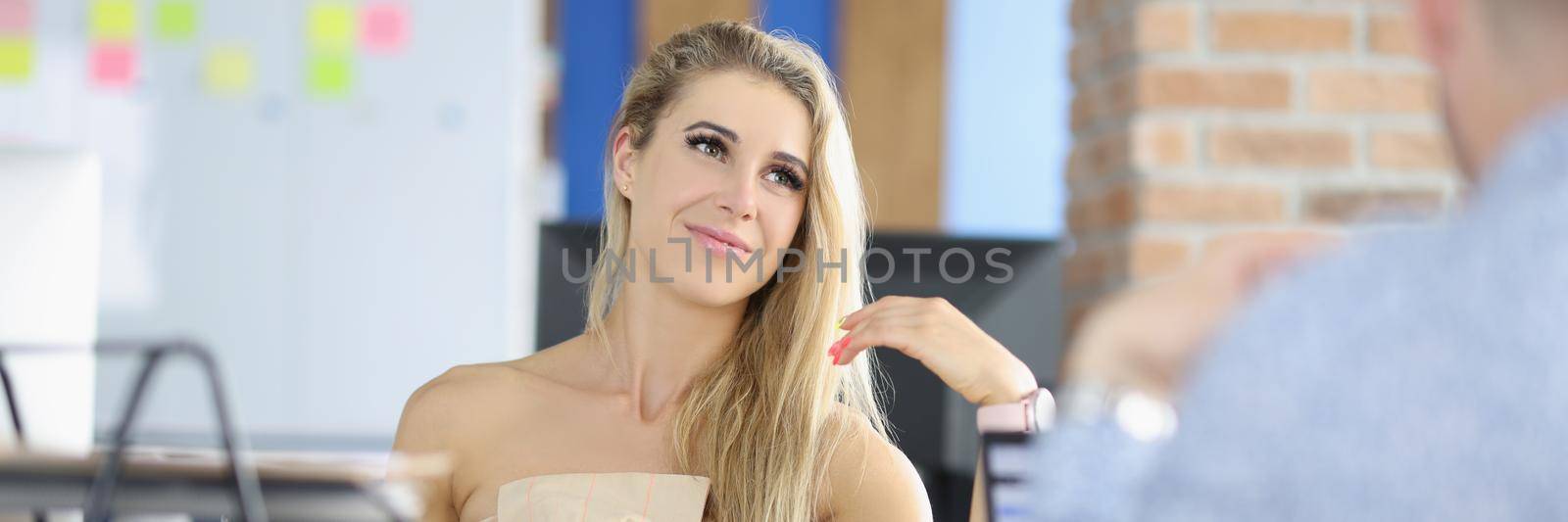 Portrait of attractive female sitting on boss seat, control big corporation, female company leader. Businesswoman interview man for work. Business concept