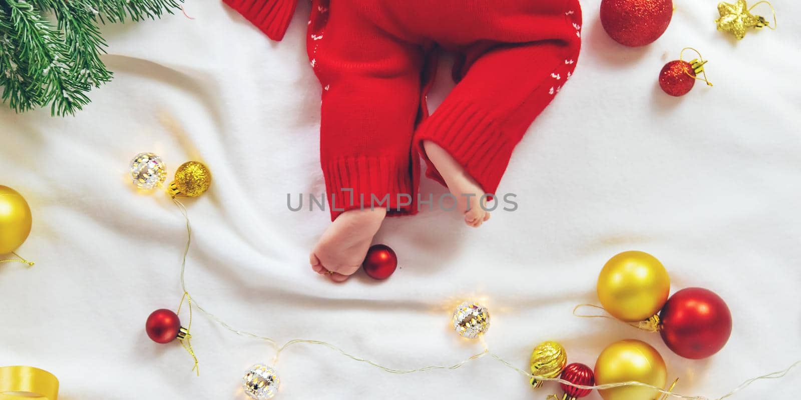 Christmas photo of baby with New Year's decor. selective focus. holiday.