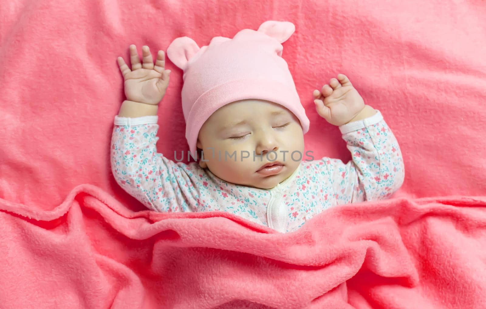 Baby sleeps with a bear. Selective focus. people.