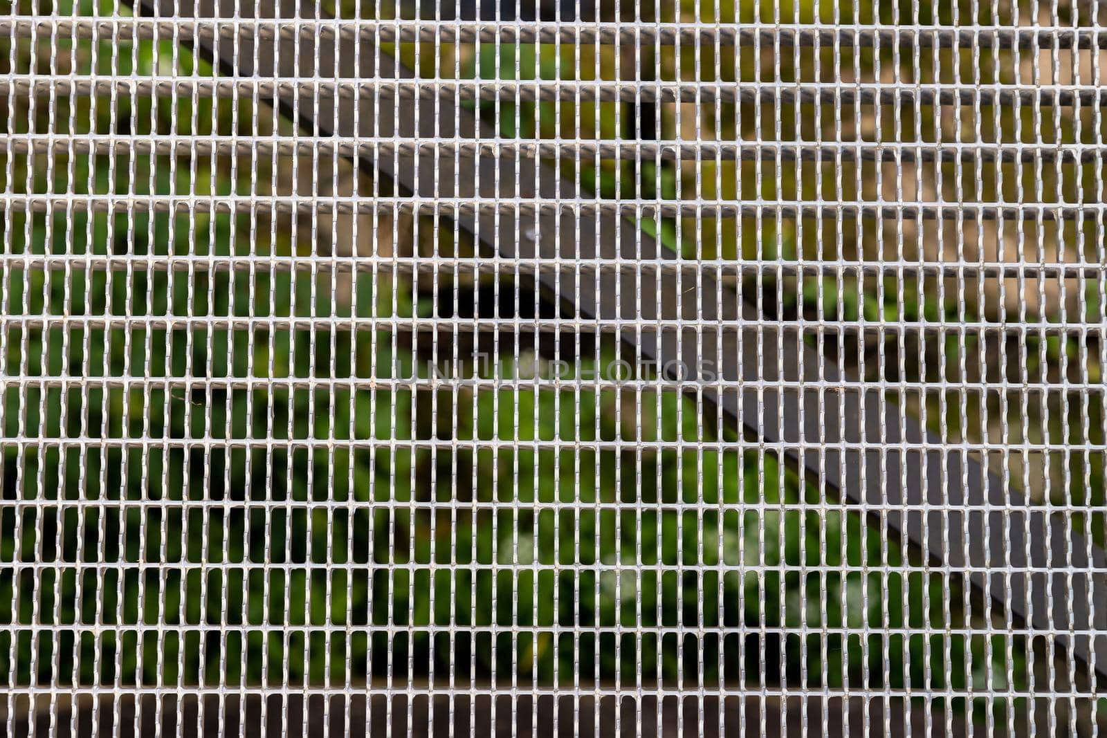 The surface of the metal grid for the floor.