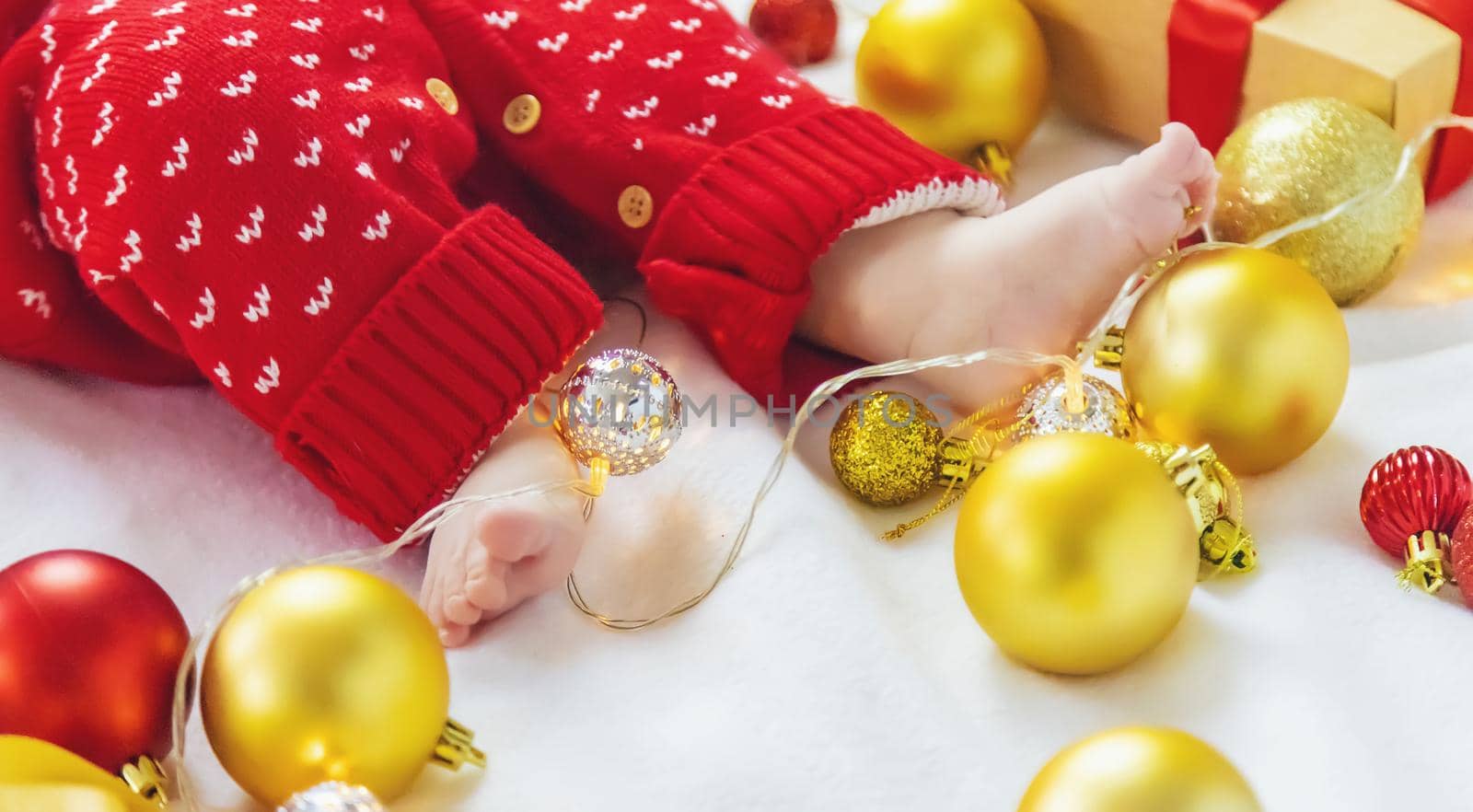 Christmas photo of baby with New Year's decor. selective focus. holiday.