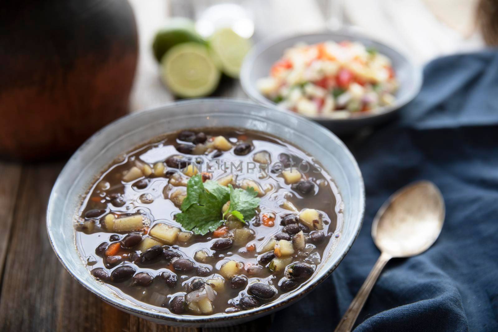 Black bean and potato soup in blue bowl