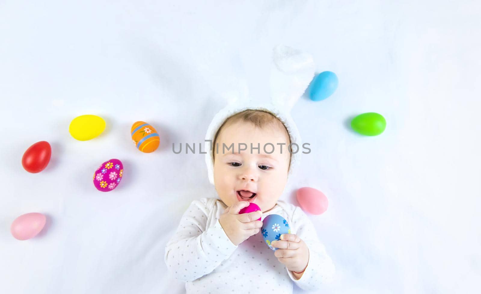 Happy easter baby holiday concept on white background. Selective focus. by yanadjana