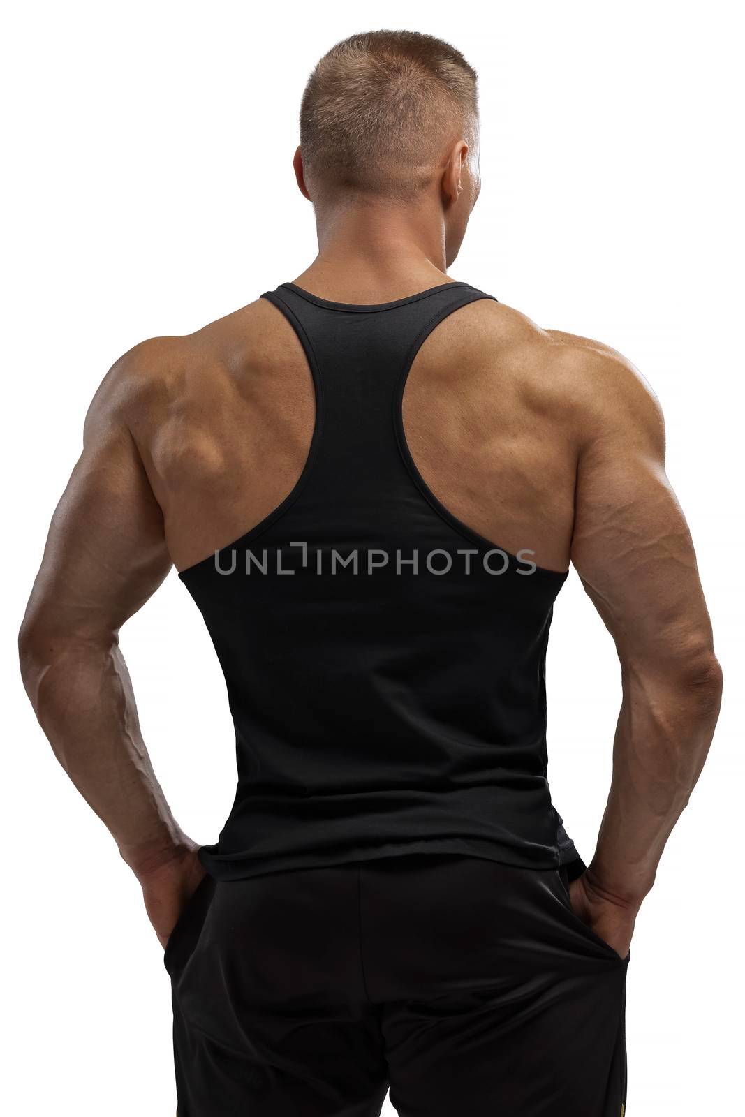 Attractive athlete posing in black tank-top in white background by but_photo