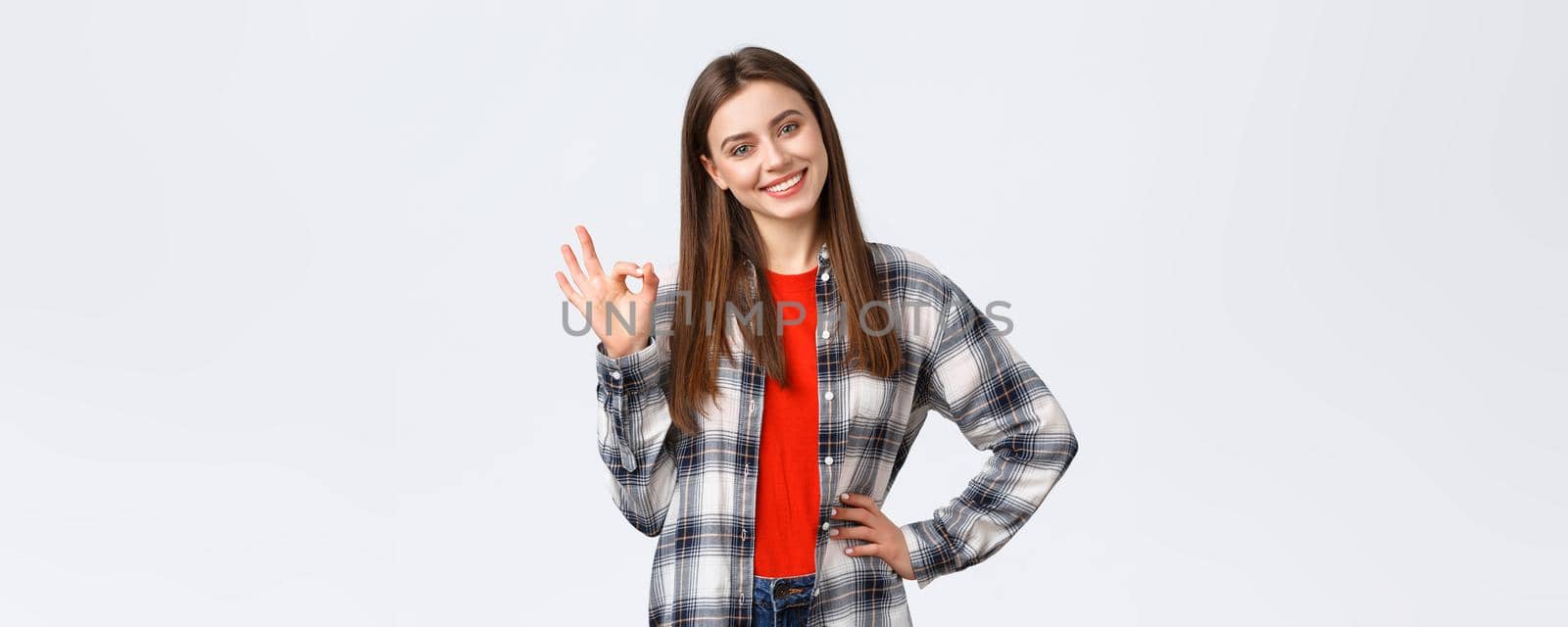 Lifestyle, different emotions, leisure activities concept. Confident beautiful young woman say no problem, guarantee quality, show okay sign, tilt head and smiling pleased, satisfied good result by Benzoix