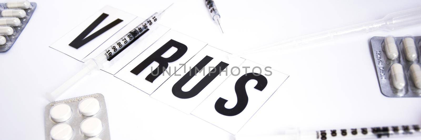 Banner The word virus on a white background with syringe pills, medicines, Health concept, Chinese 2019 coronavirus