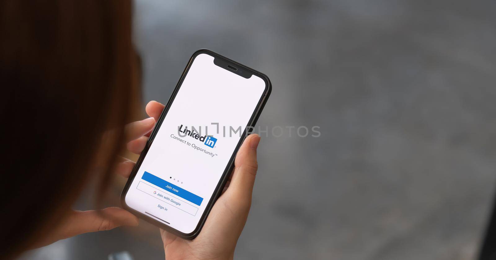 CHIANG MAI, THAILAND - APR 4, 2021: iPhone 12 with LinkedIn application on the screen. LinkedIn is a business-oriented social networking service.