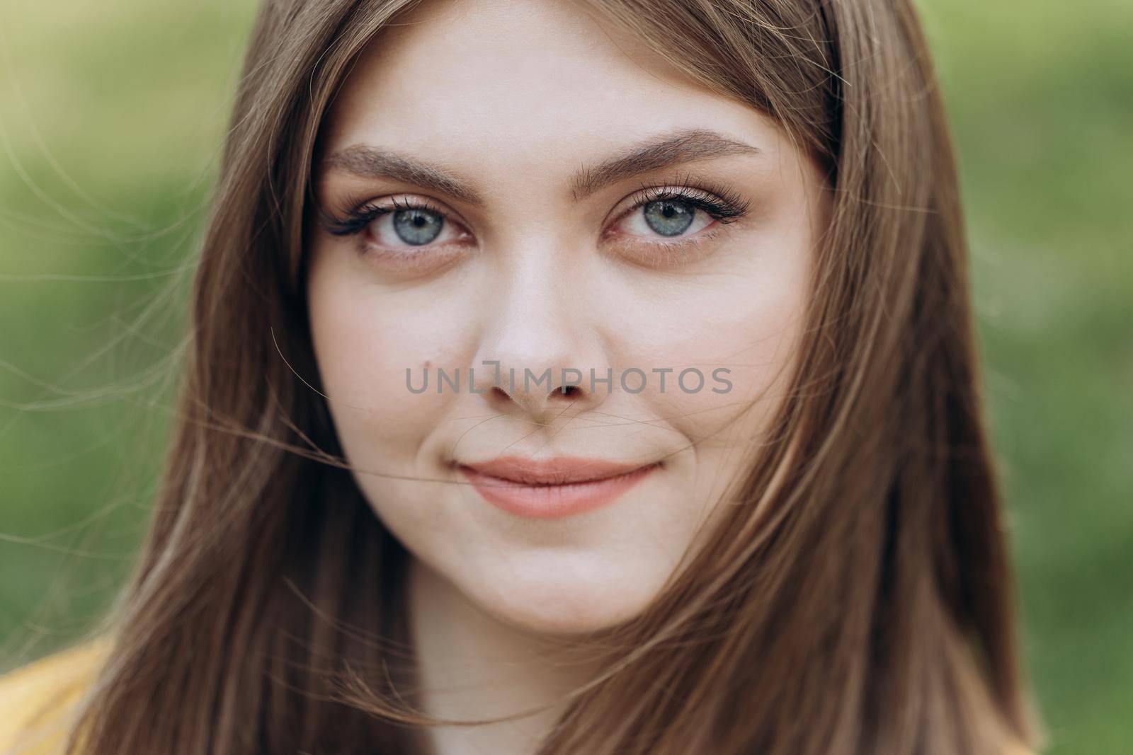 Front close up of caucasian woman, beautiful young human face with white skin, smile look at camera open and confident. Portrait of caucasian european lady. by uflypro