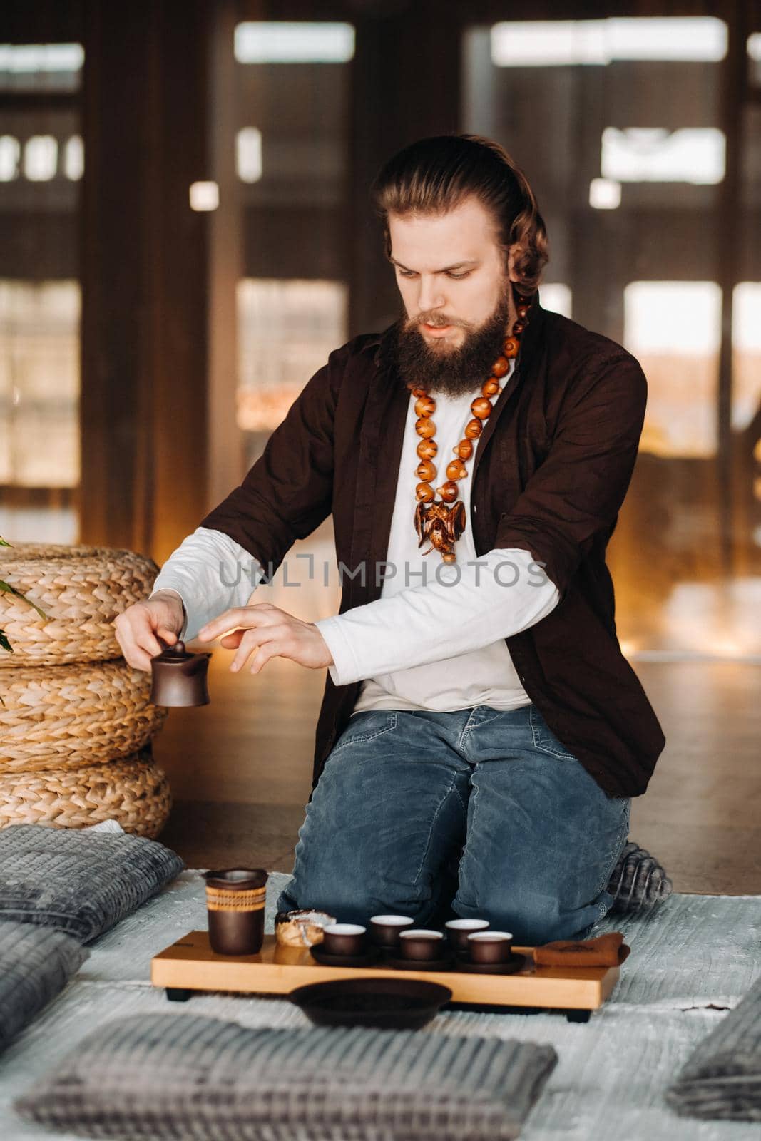 The tea master is preparing to hold a tea ceremony in the interior.