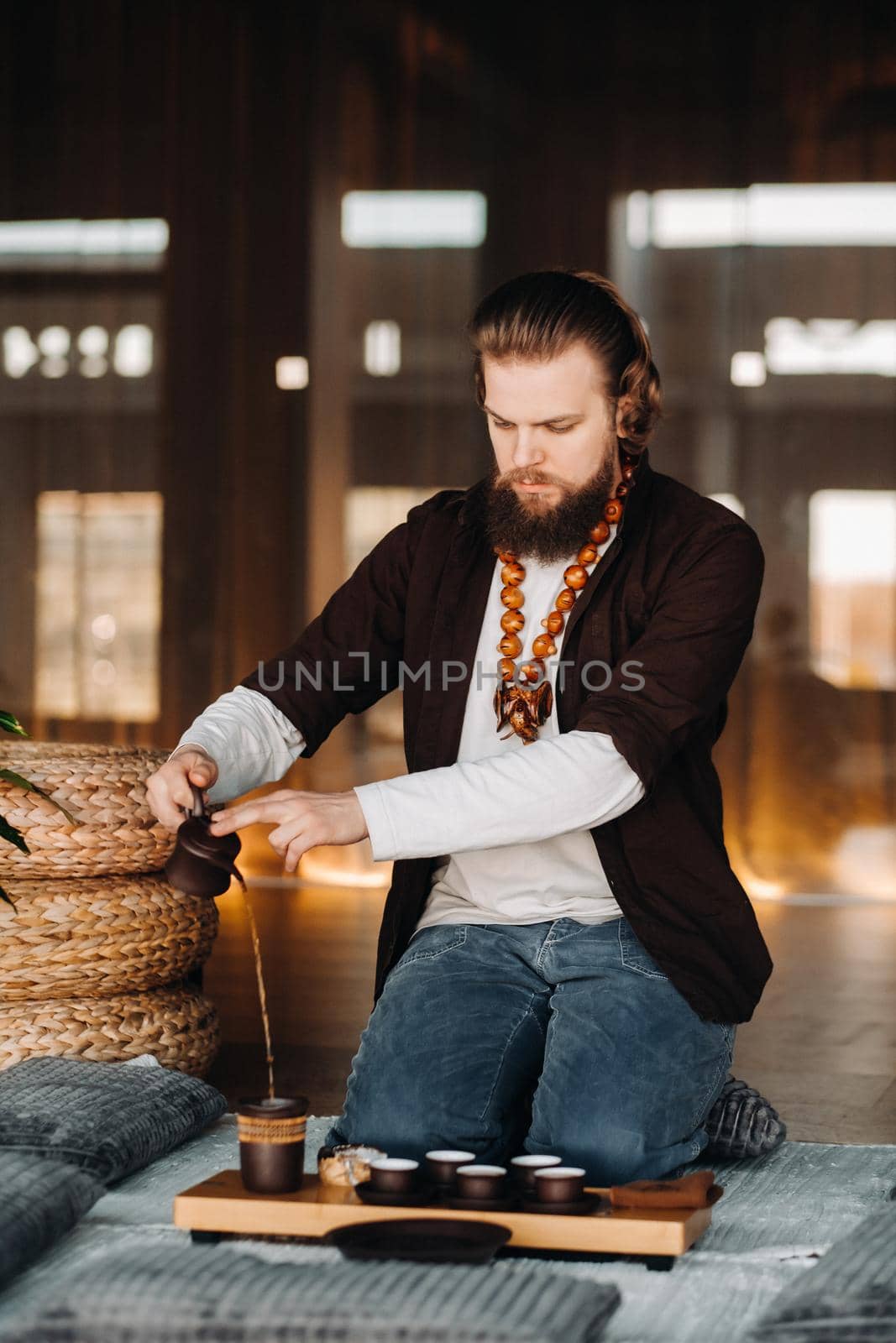 The tea master is preparing to hold a tea ceremony in the interior.