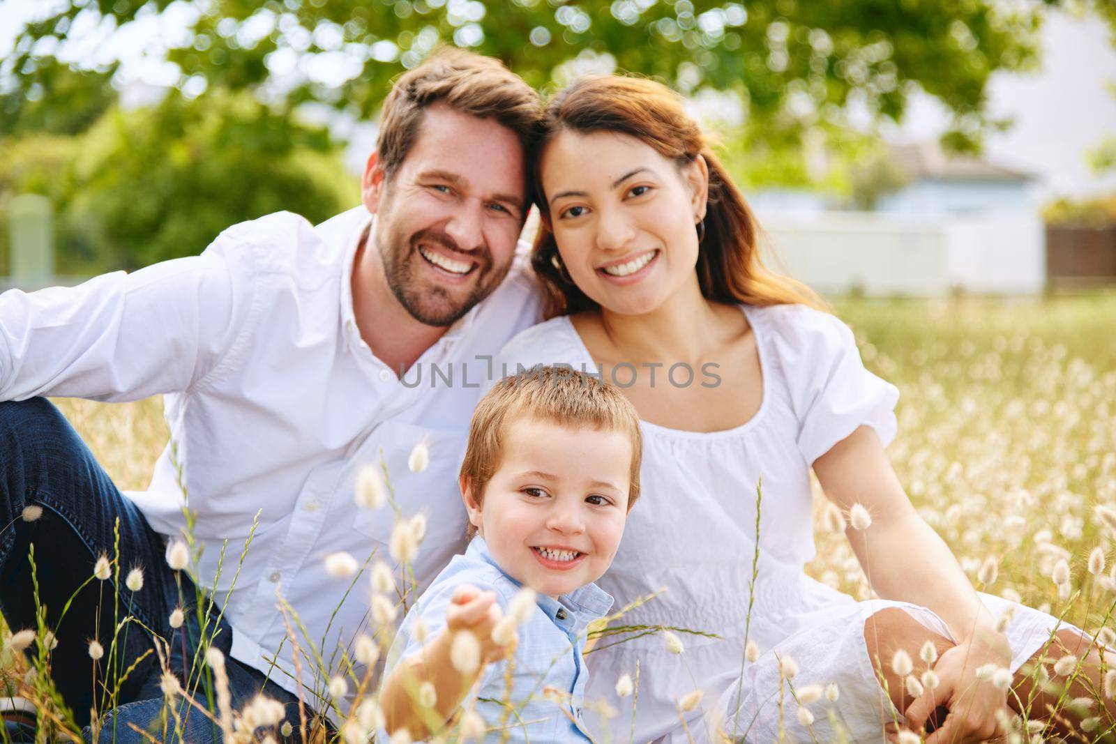 Shot of a young family spending time together at the park.