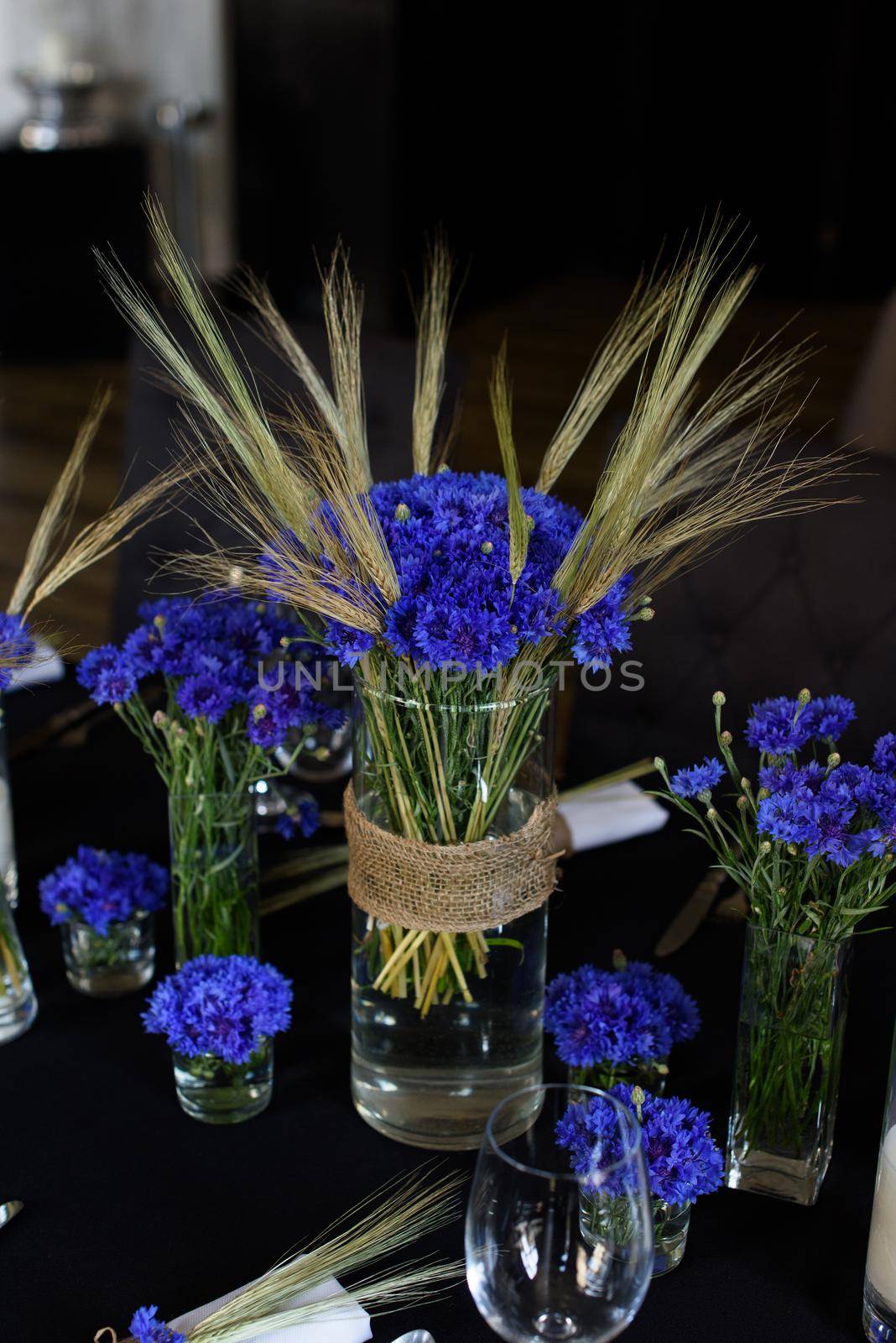 A set of furniture in a cafe. Vase with flowers decor for the restaurant. Black tablecloth by Ashtray25