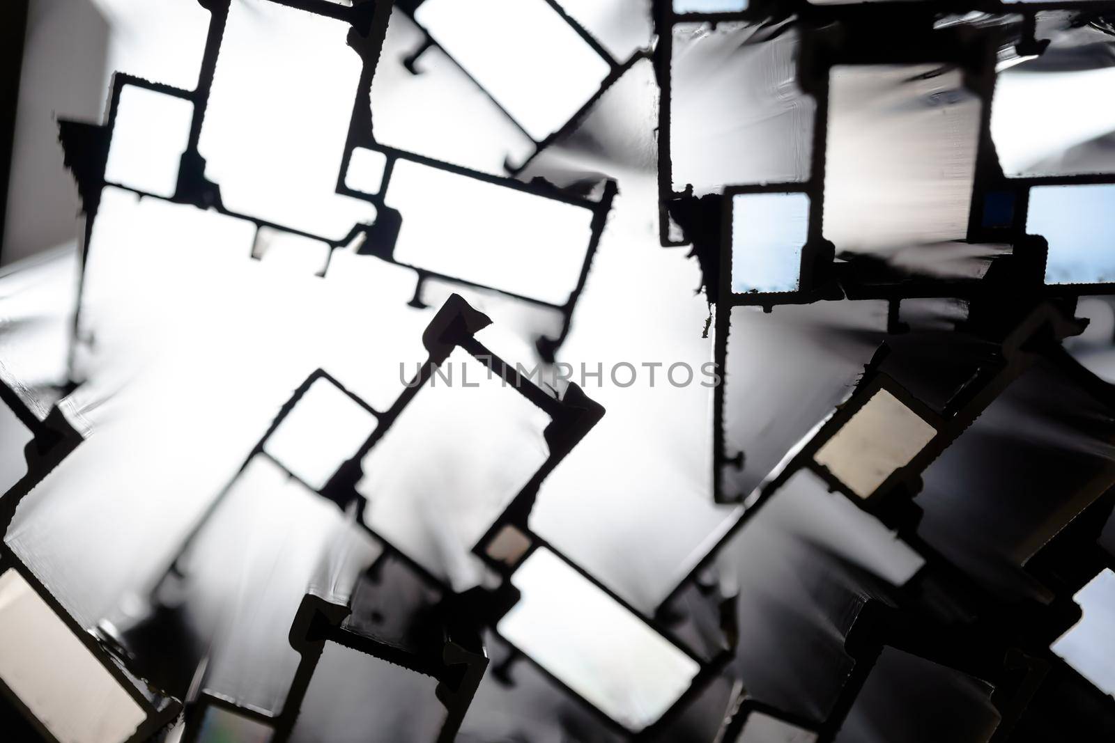 Steel factory warehouse displayed aluminum profile for window, door, bathroom box with blurry background, used as a background or texture, soft focus